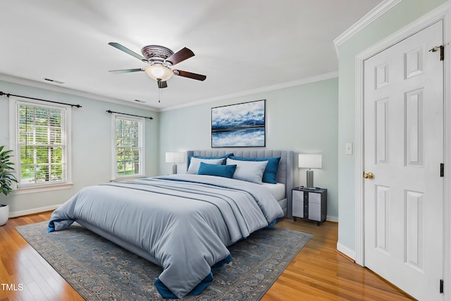 6201 King Croydon Ct, Raleigh, NC 27603 - bedroom with light wood-type flooring, crown molding, and a ceiling fan