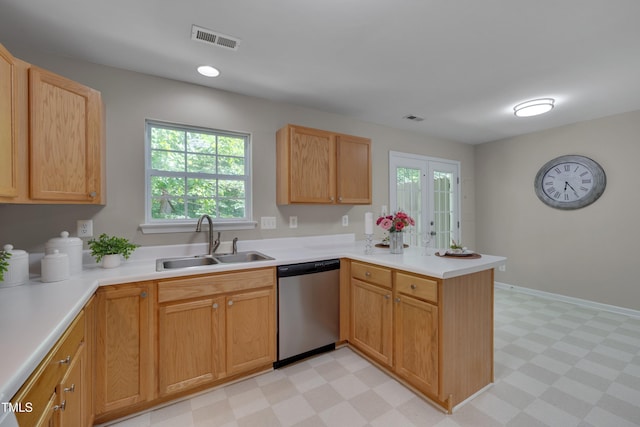 314 Virens Dr, Cary, NC 27511 - kitchen featuring dishwasher, a sink, light flooring, a peninsula, and light countertops
