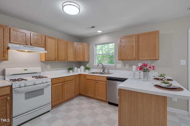 314 Virens Dr, Cary, NC 27511 - kitchen featuring gas range gas stove, stainless steel dishwasher, under cabinet range hood, light floors, and a peninsula