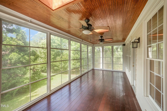 unfurnished sunroom featuring ceiling fan