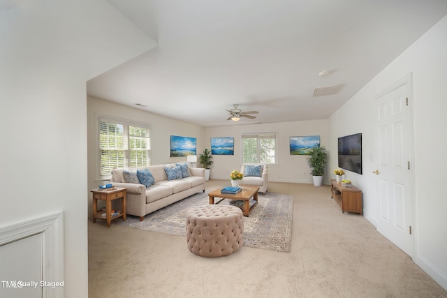 living room featuring carpet flooring, a ceiling fan, and baseboards