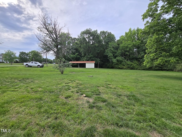 3669 W Greensboro Chapel Hill Rd, Liberty, NC 27298 - view of green lawn with a carport