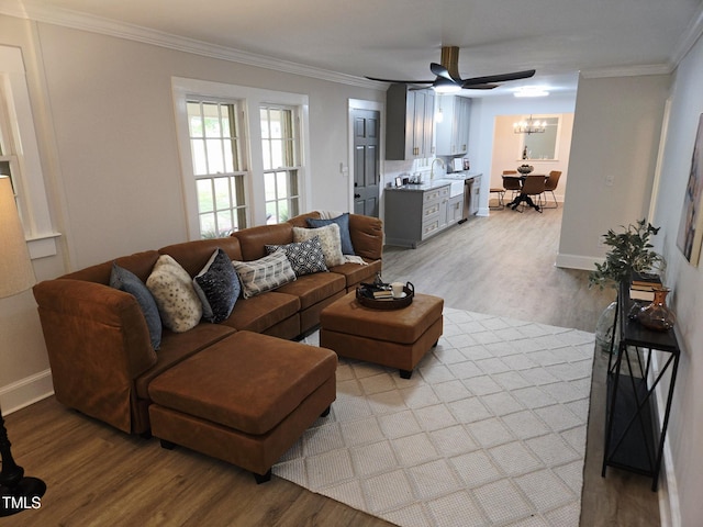 3669 W Greensboro Chapel Hill Rd, Liberty, NC 27298 - living room featuring light wood-style floors, a chandelier, crown molding, baseboards, and ceiling fan