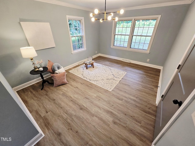 3669 W Greensboro Chapel Hill Rd, Liberty, NC 27298 - unfurnished room featuring crown molding, plenty of natural light, wood finished floors, a chandelier, and baseboards
