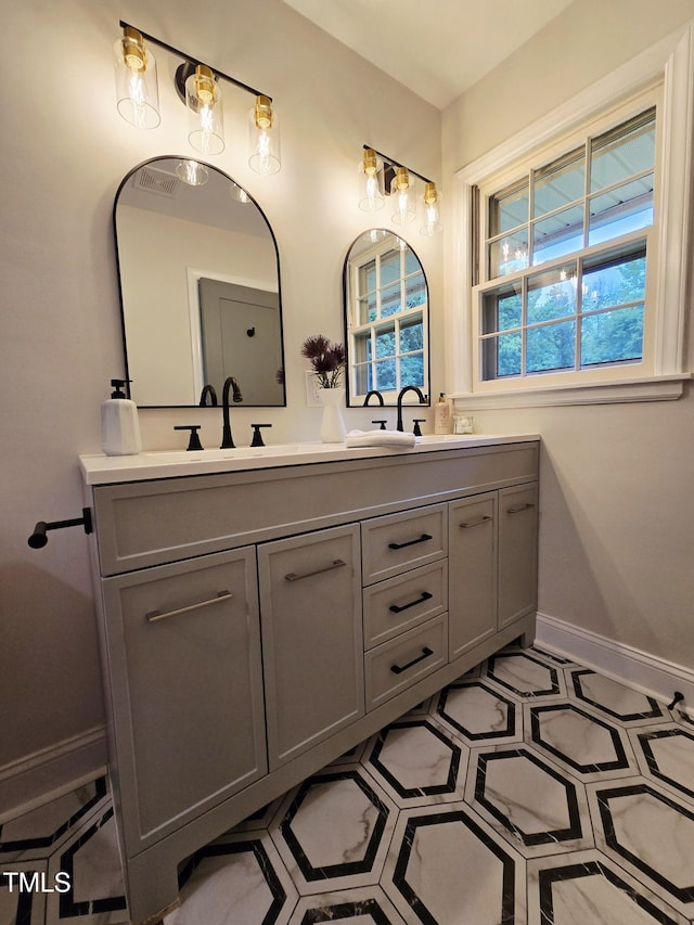 3669 W Greensboro Chapel Hill Rd, Liberty, NC 27298 - full bath featuring double vanity and baseboards