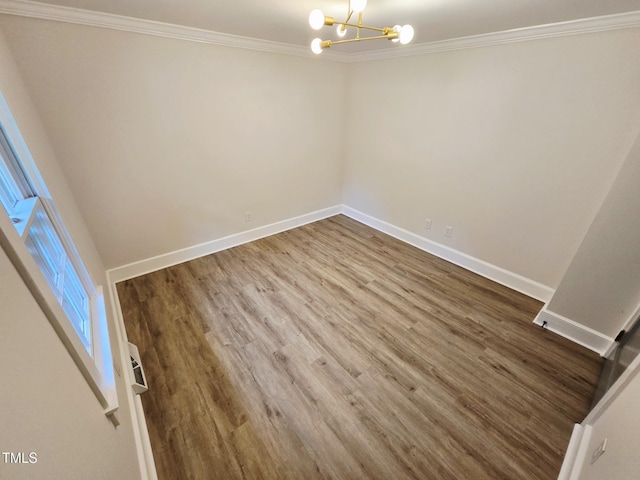 3669 W Greensboro Chapel Hill Rd, Liberty, NC 27298 - empty room featuring a chandelier, ornamental molding, baseboards, and wood finished floors