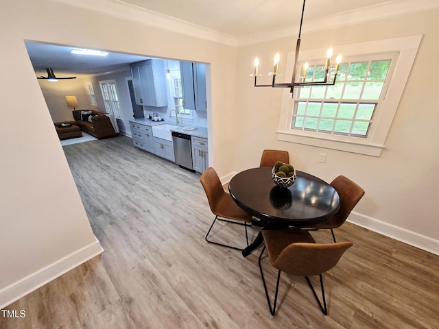 3669 W Greensboro Chapel Hill Rd, Liberty, NC 27298 - dining room with a chandelier, baseboards, ornamental molding, wood finished floors, and ceiling fan