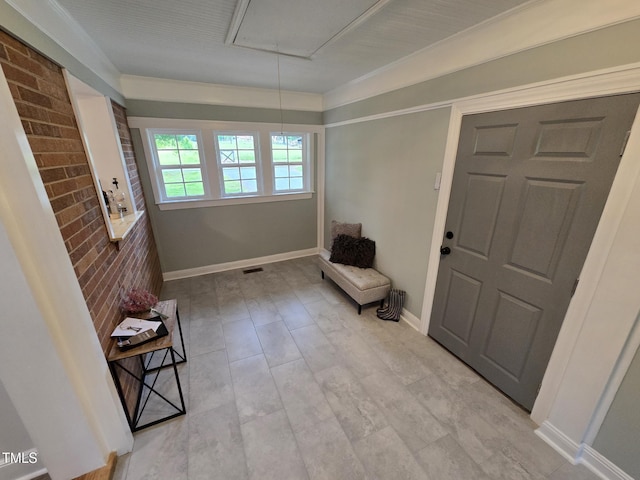 3669 W Greensboro Chapel Hill Rd, Liberty, NC 27298 - living area with attic access, brick wall, and baseboards