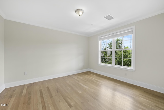 340 Allister Dr Unit 301, Raleigh, NC 27609 - unfurnished room featuring baseboards, ornamental molding, and light wood-type flooring