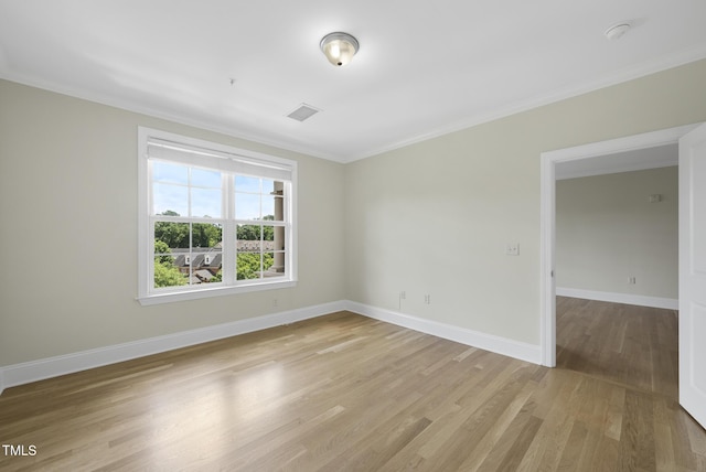 340 Allister Dr Unit 301, Raleigh, NC 27609 - unfurnished room with ornamental molding, light wood finished floors, baseboards, and a smoke detector