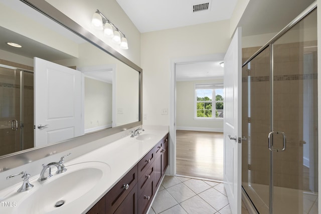 340 Allister Dr Unit 301, Raleigh, NC 27609 - full bath featuring double vanity, tile patterned floors, and a shower stall