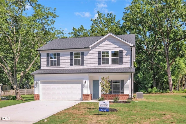 114 Hays St, Oxford, NC 27565 - view of front facade with driveway, a garage, roof with shingles, and brick siding