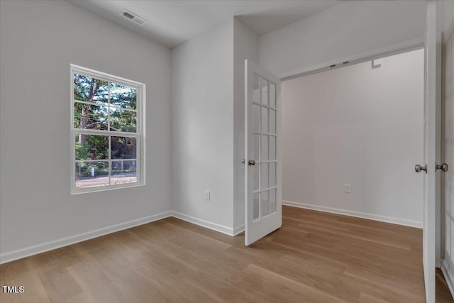 114 Hays St, Oxford, NC 27565 - spare room featuring french doors and wood finished floors