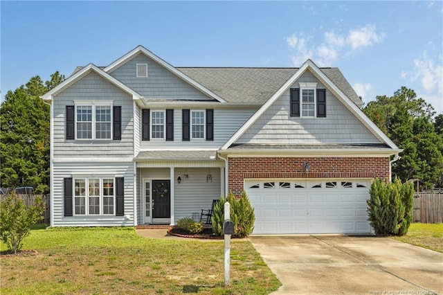 view of front facade with driveway, a garage, and brick siding