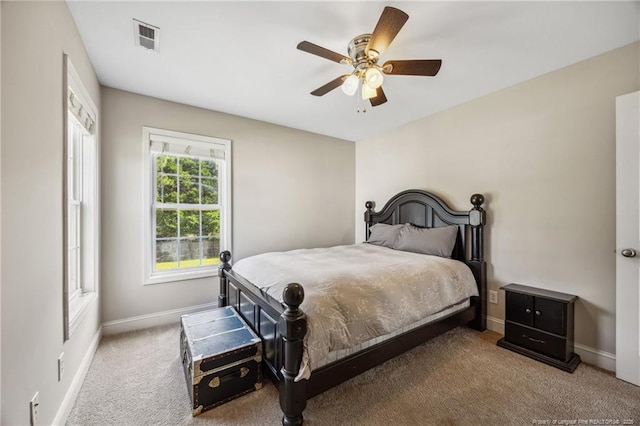 bedroom with baseboards, carpet flooring, and ceiling fan