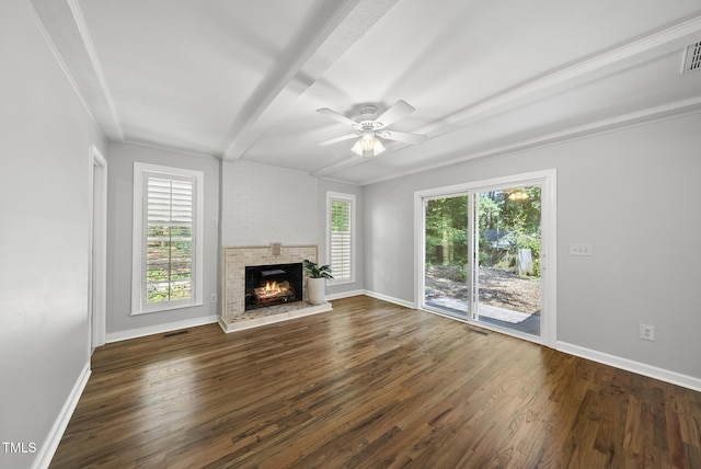 1201 Pond St, Cary, NC 27511 - unfurnished living room featuring dark wood-style floors, a brick fireplace, a ceiling fan, and beam ceiling