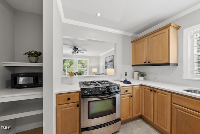 1201 Pond St, Cary, NC 27511 - kitchen featuring gas stove, black microwave, ornamental molding, light tile patterned floors, and tasteful backsplash