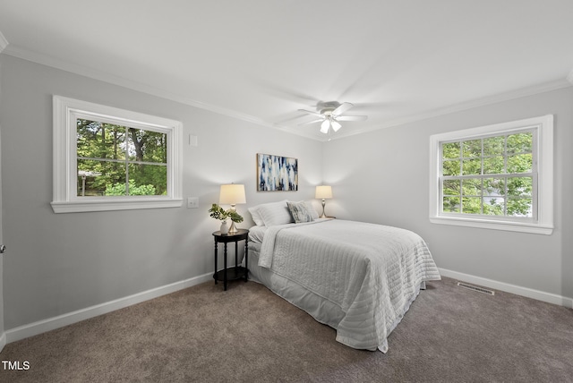 1201 Pond St, Cary, NC 27511 - carpeted bedroom featuring crown molding, multiple windows, and a ceiling fan