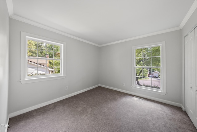 1201 Pond St, Cary, NC 27511 - carpeted spare room with healthy amount of natural light and crown molding