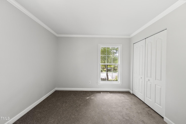 1201 Pond St, Cary, NC 27511 - unfurnished bedroom with crown molding, carpet, and a closet
