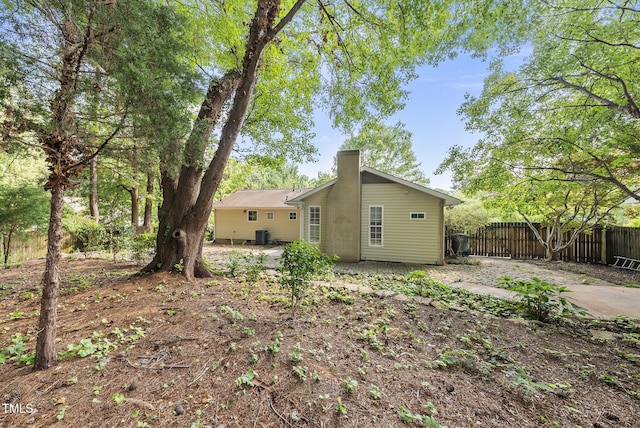 1201 Pond St, Cary, NC 27511 - back of house featuring a chimney and a patio