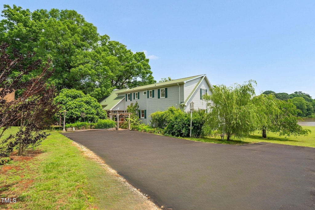 view of front of home featuring asphalt driveway