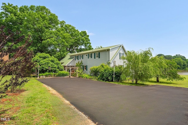 view of front of home featuring asphalt driveway