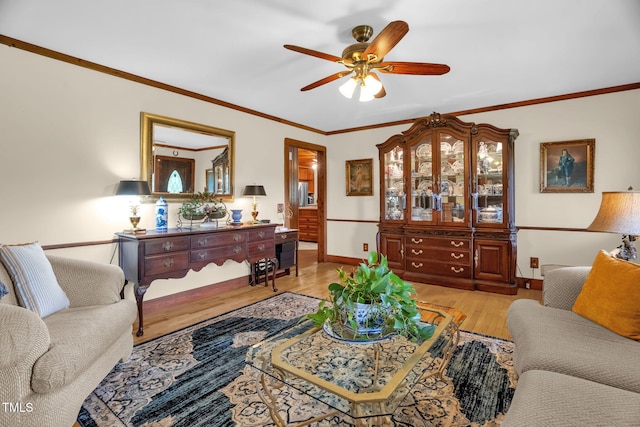 771 Cedar Grove Church Rd, Roxboro, NC 27574 - living area featuring a ceiling fan, light wood finished floors, ornamental molding, and baseboards