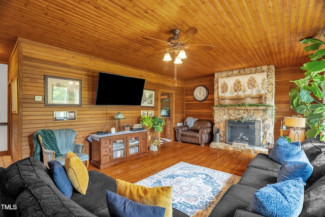 771 Cedar Grove Church Rd, Roxboro, NC 27574 - living area featuring wooden ceiling, ceiling fan, wood finished floors, a fireplace, and wood walls