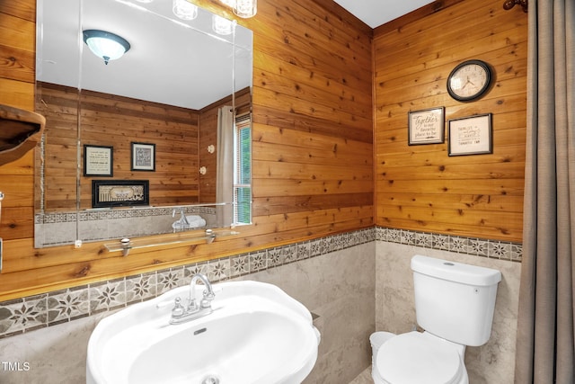 771 Cedar Grove Church Rd, Roxboro, NC 27574 - half bath with a sink, toilet, wooden walls, and a wainscoted wall