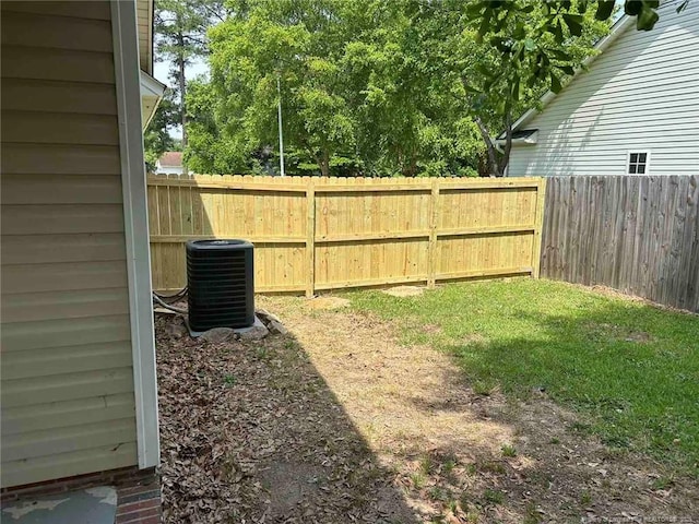 view of yard with central AC