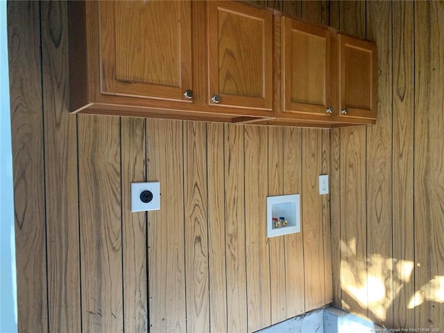 4212 Forest View Dr, Fayetteville, NC 28304 - clothes washing area featuring cabinet space, hookup for a washing machine, electric dryer hookup, and wood walls