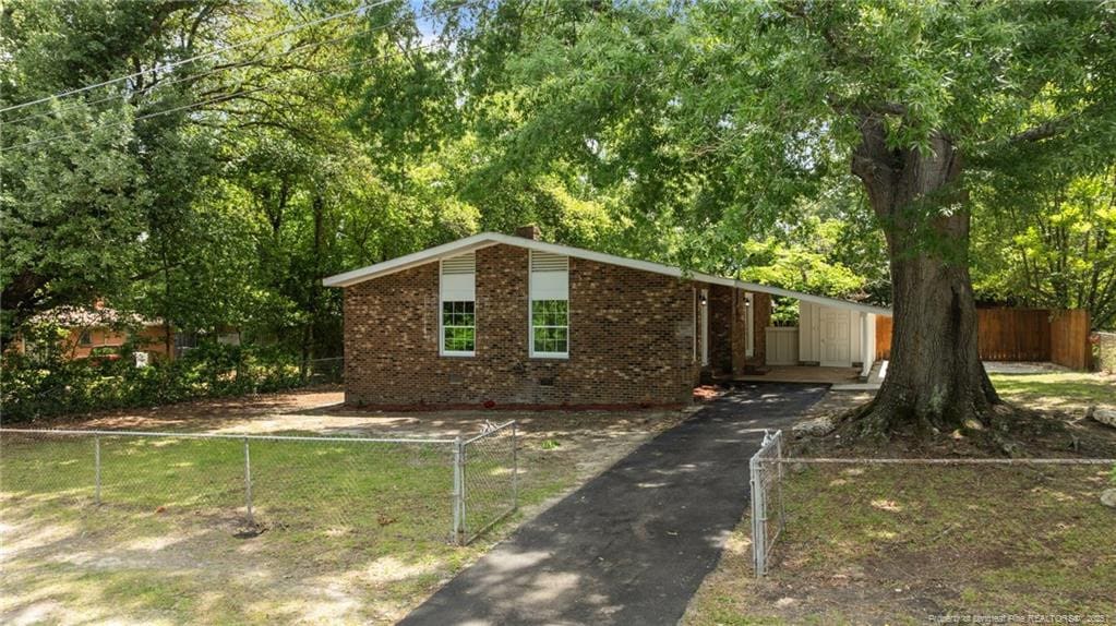 2105 Lombardy Dr, Fayetteville, NC 28304 - mid-century inspired home featuring brick siding and driveway