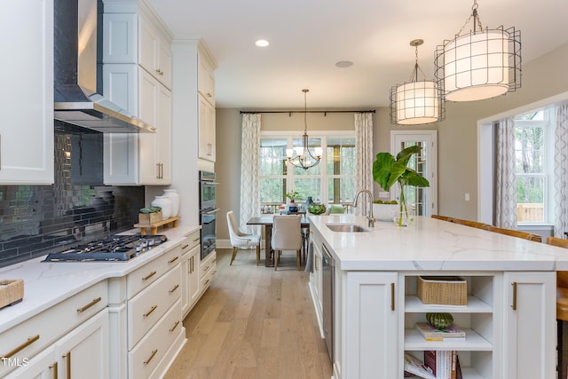 1412 Auman Rd, Raleigh, NC 27603 - kitchen with wall chimney range hood, a sink, stainless steel appliances, white cabinets, and tasteful backsplash