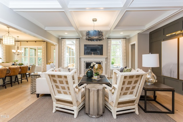 1412 Auman Rd, Raleigh, NC 27603 - living room with a chandelier, light wood-style flooring, a fireplace, coffered ceiling, and beam ceiling