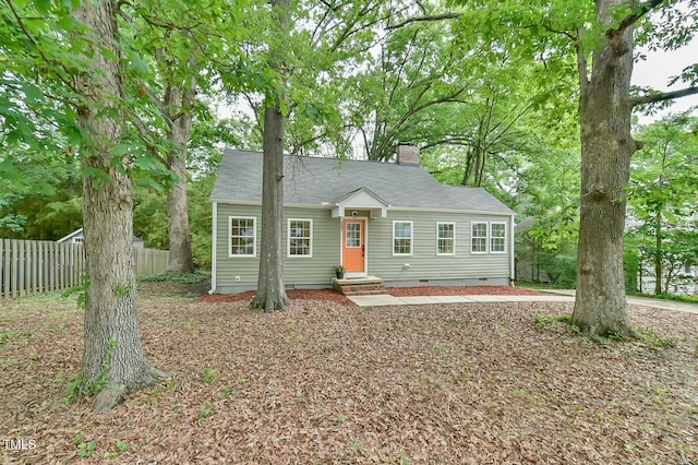 bungalow with fence, crawl space, and a chimney