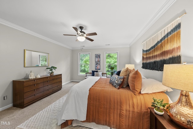 bedroom with carpet, baseboards, ornamental molding, and ceiling fan
