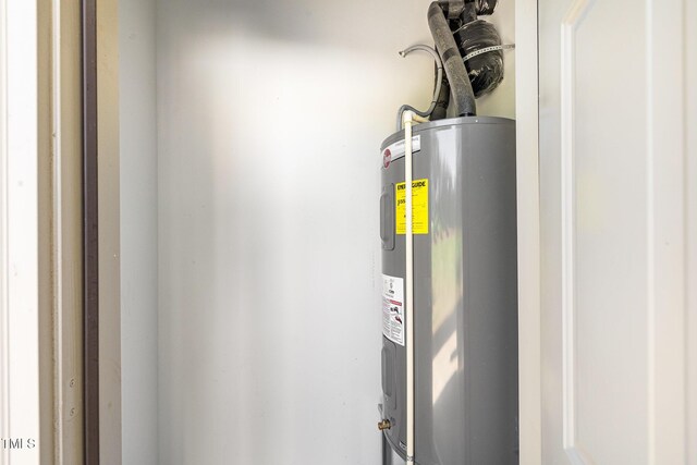 utility room featuring electric water heater