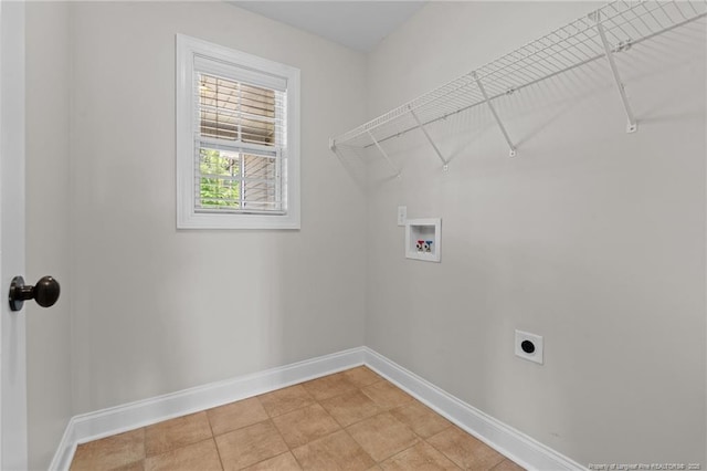 laundry area featuring hookup for a washing machine, baseboards, electric dryer hookup, and light tile patterned flooring