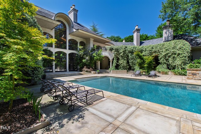 6510 New Market Way, Raleigh, NC 27615 - outdoor pool with a patio area and french doors
