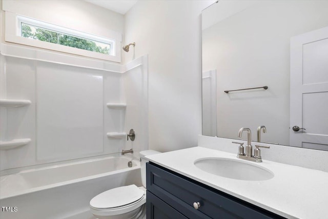 bathroom with toilet, shower / tub combination, and vanity