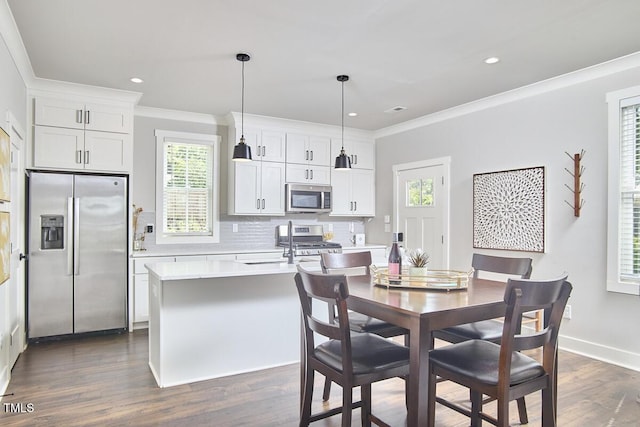 941 W Club Blvd, Durham, NC 27701 - dining room featuring dark wood finished floors, crown molding, recessed lighting, and baseboards