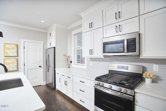 941 W Club Blvd, Durham, NC 27701 - kitchen with appliances with stainless steel finishes, a sink, backsplash, light stone countertops, and white cabinetry