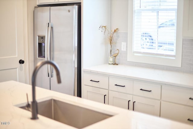 941 W Club Blvd, Durham, NC 27701 - kitchen with stainless steel refrigerator with ice dispenser, a sink, and white cabinets