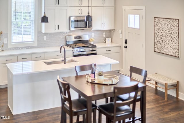 941 W Club Blvd, Durham, NC 27701 - dining space featuring dark wood-type flooring, healthy amount of natural light, and baseboards