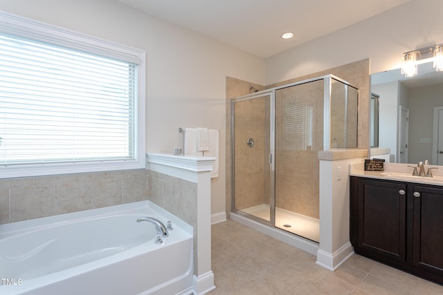 453 Granite Saddle Dr, Rolesville, NC 27571 - full bathroom with a bath, vanity, a shower stall, tile patterned floors, and baseboards