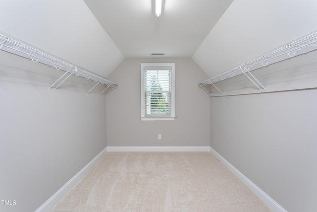 453 Granite Saddle Dr, Rolesville, NC 27571 - walk in closet featuring lofted ceiling and carpet