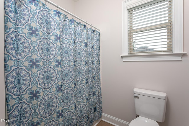 453 Granite Saddle Dr, Rolesville, NC 27571 - full bath featuring baseboards, toilet, and curtained shower