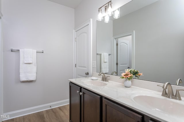 453 Granite Saddle Dr, Rolesville, NC 27571 - bathroom with double vanity, wood finished floors, and baseboards