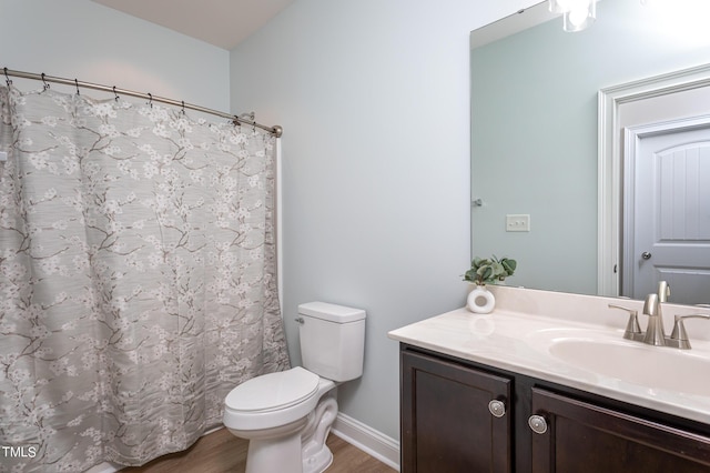 453 Granite Saddle Dr, Rolesville, NC 27571 - full bath with wood finished floors, vanity, toilet, baseboards, and a shower with curtain